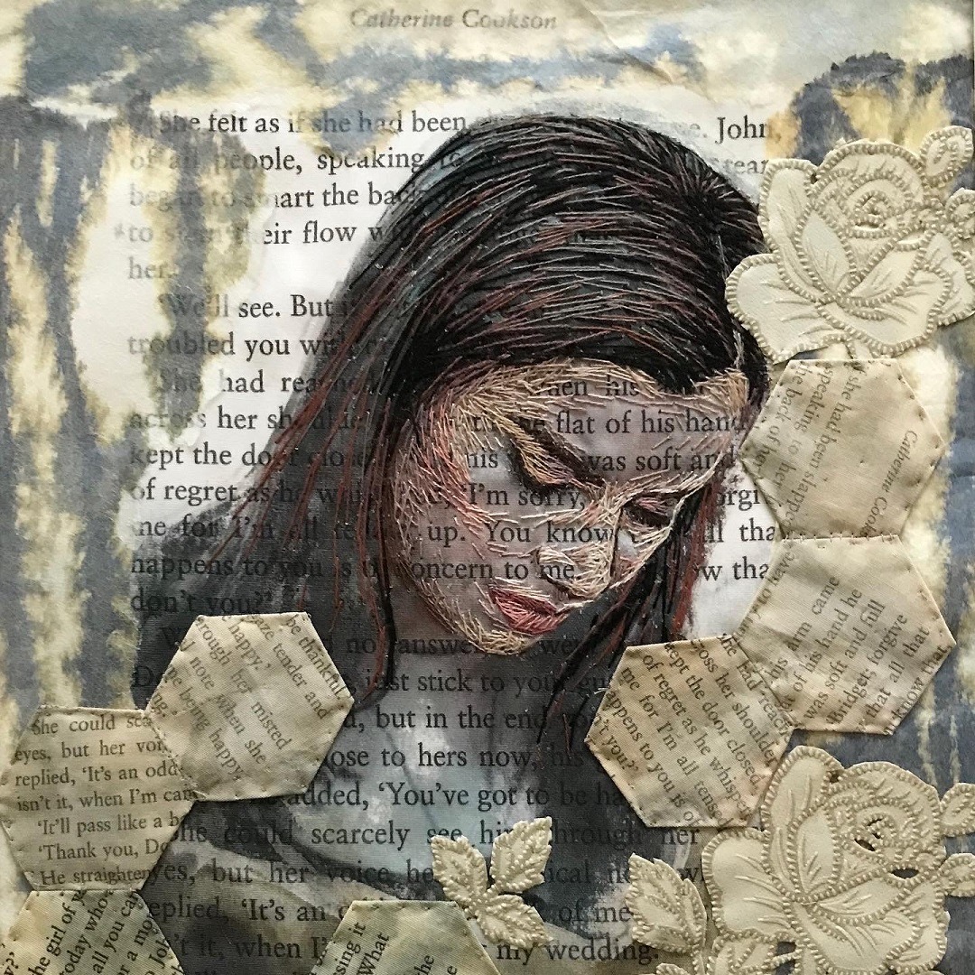 Lesley Wood, Northern Narratives, 2021. 35cm x 25cm (13½" x 10"). Hand embroidered fabric collage. Transfer printed text on cotton fabrics, ink stained cotton and tea bag fabric, paint, plastic tablecloth roses, embroidery threads.