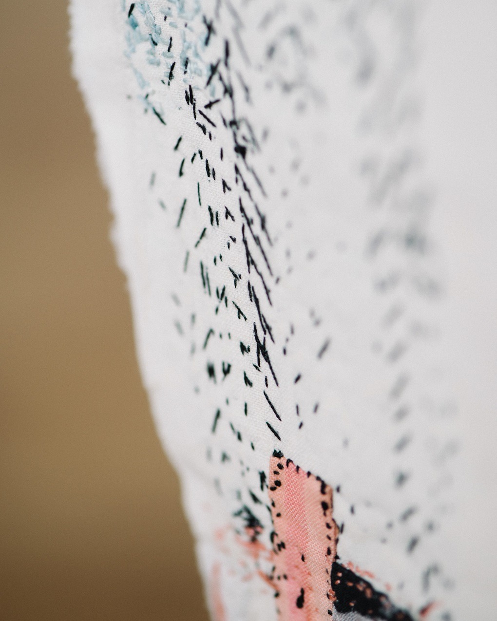 Kate Whitehead, Daughter (detail), 2019. 32cm x 16cm (12½" x 6½"). Child’s vintage cotton bodice, black silk, black and pink fabric patches, pink silk embroidery thread. Embroidery. Photo: Sarah Mason Photography.