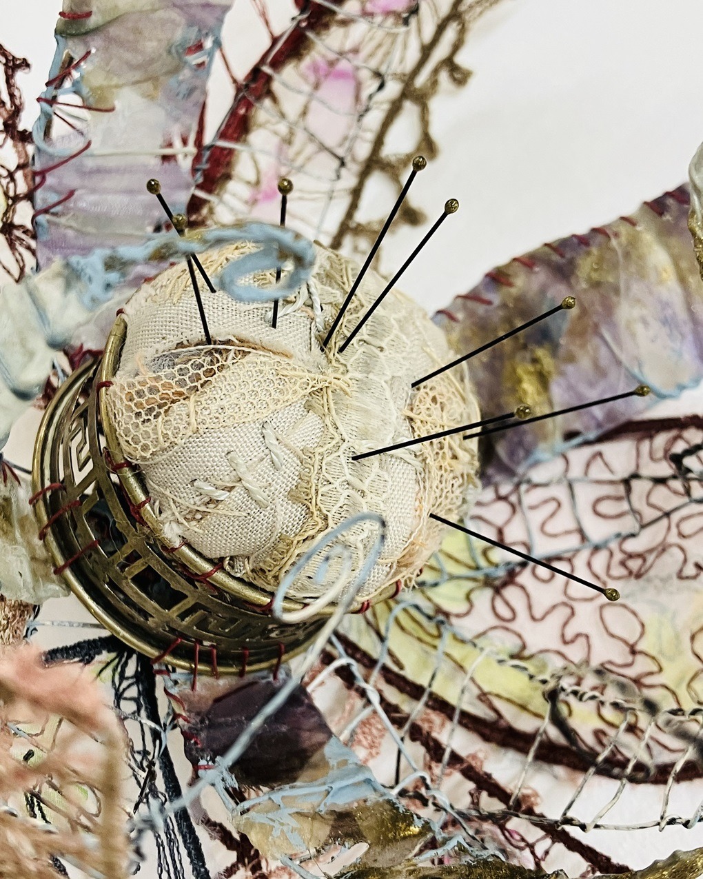 Priscilla Edwards, Pimpilowe (detail), 2023. 21cm x 50cm (8" x 20"). Free machine embroidery, hand stitch, hand manipulated wire. Wire, leather, rayon thread, linen thread, cotton thread, silk, cotton, lace, wax, paint, entomology pins, found object.