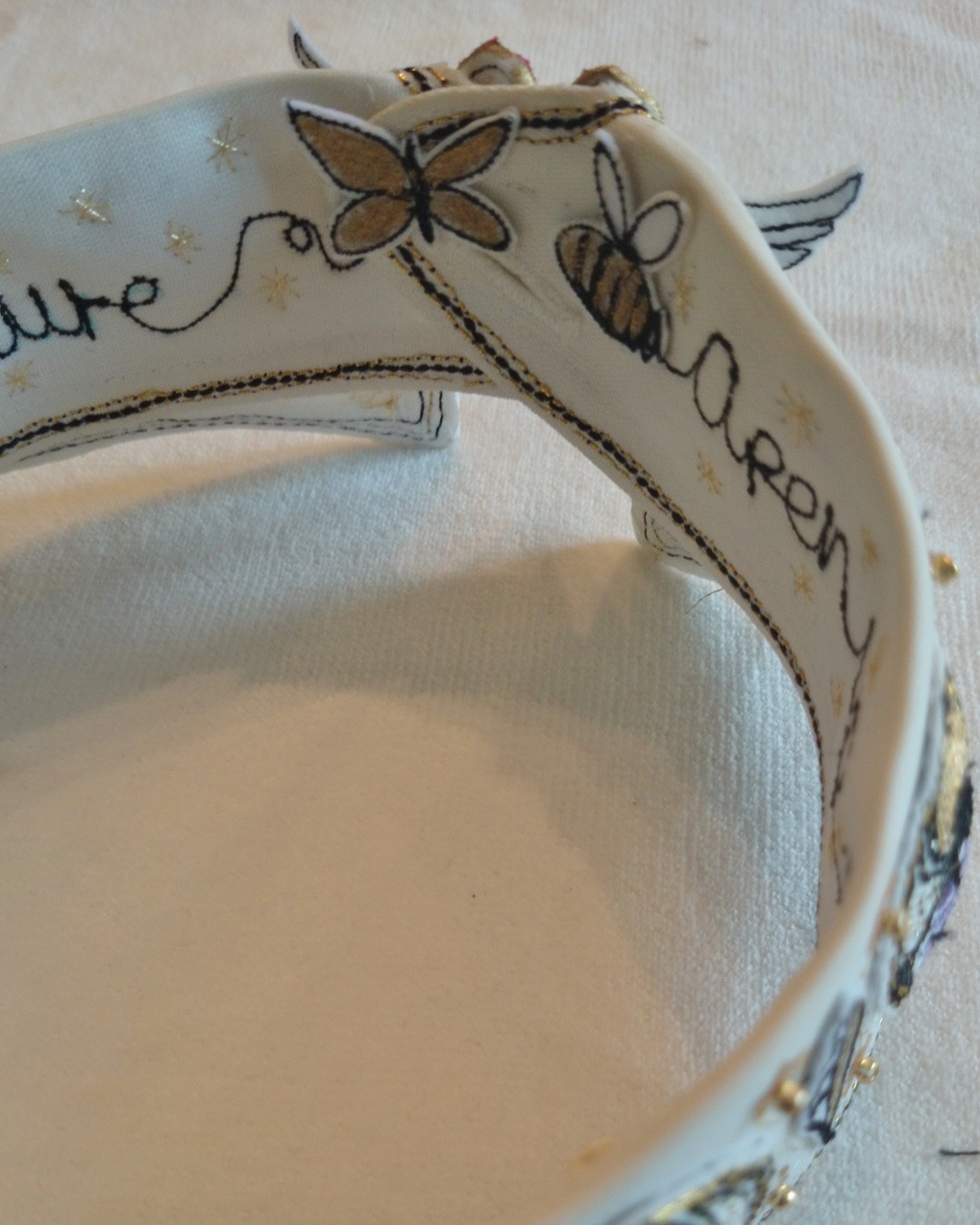 Angie Hughes, Open Up them Pearly Gates (detail), 2014. 25cm x 25cm (10" x 10"). Applied stitched objects, hand and machine stitch. Cotton and linen.
