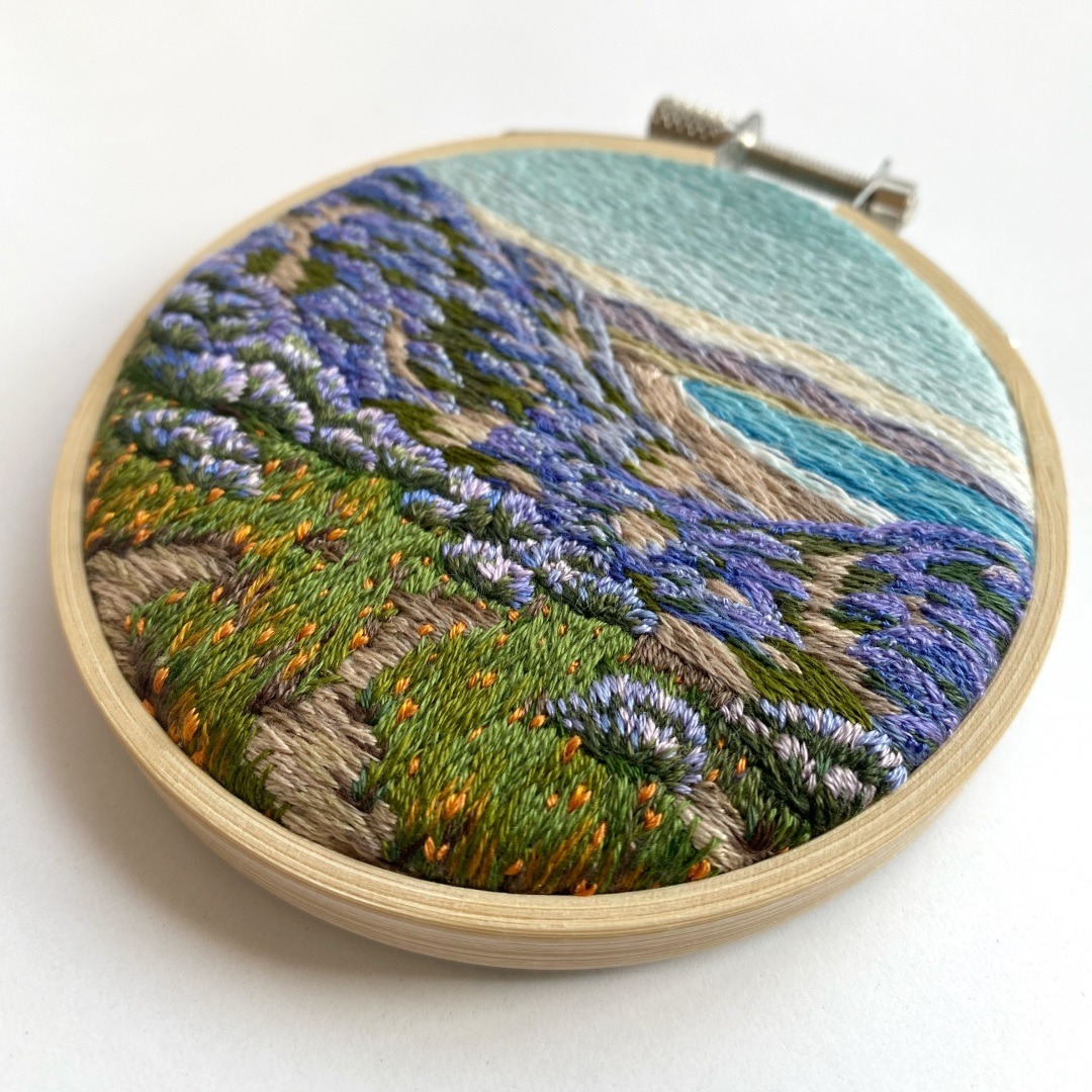 Cassandra Dias, Lupine in California – John Gamble Repro, 2022. 9cm (3.5"). Thread painting. Cotton embroidery thread, canvas, bamboo hoop.