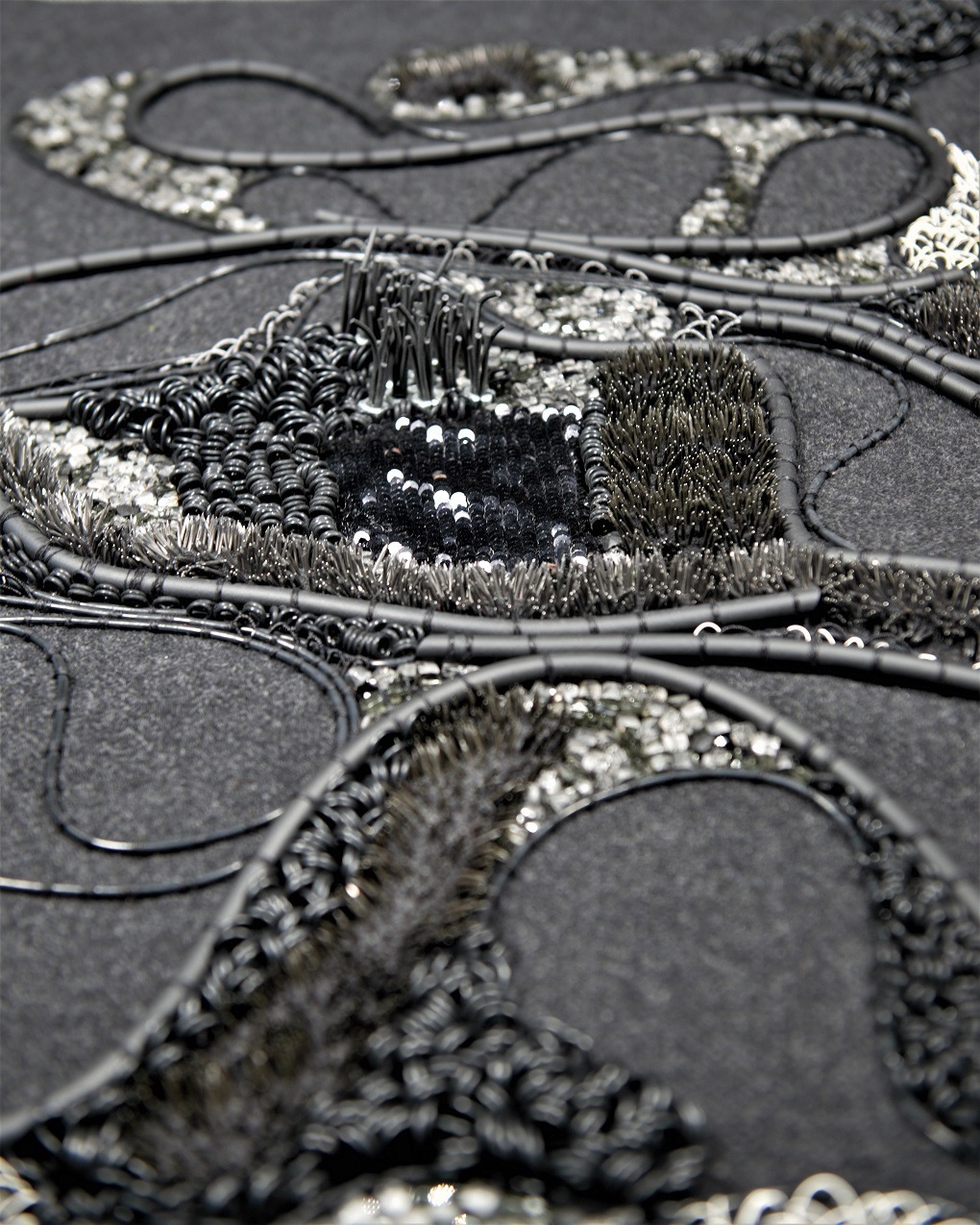 Elnaz Yazdani, Magnetic World, 2020. 60cm x 50cm (24" x 20"). Goldwork, couching, beadwork, embellishments. Rubber, wire, glass, purl wire, pins, metal, sequins, crystal beading.
