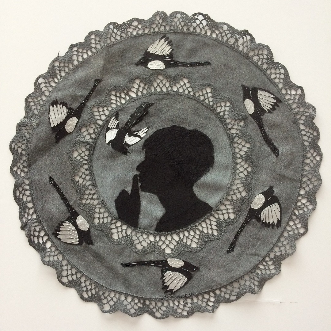 Lesley Wood, 7 For A Secret Never To Be Told (Magpie Rhyme Series), 2019. 26cm (10") diameter on A3 mount board. Hand embroidered appliquéd collage. Hand dyed vintage table cloth, embroidery thread, scraps of assorted fabrics.