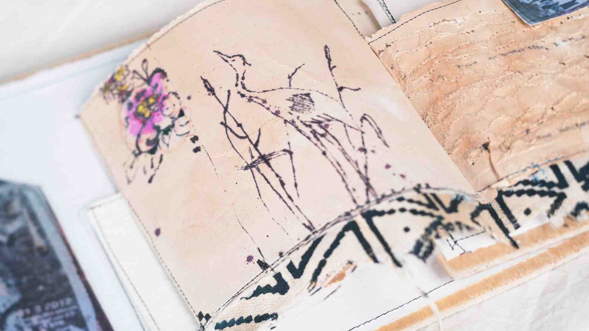 Kate Whitehead, Not From the Stork sketchbook, 2019. Painting, dyeing with tea, drawing, screen printing, machine stitching. Hard wood book cover, water colour paints, blotting paper pages, labels, black ink, sewing machine threads. Photo: Marie Popham Photography.