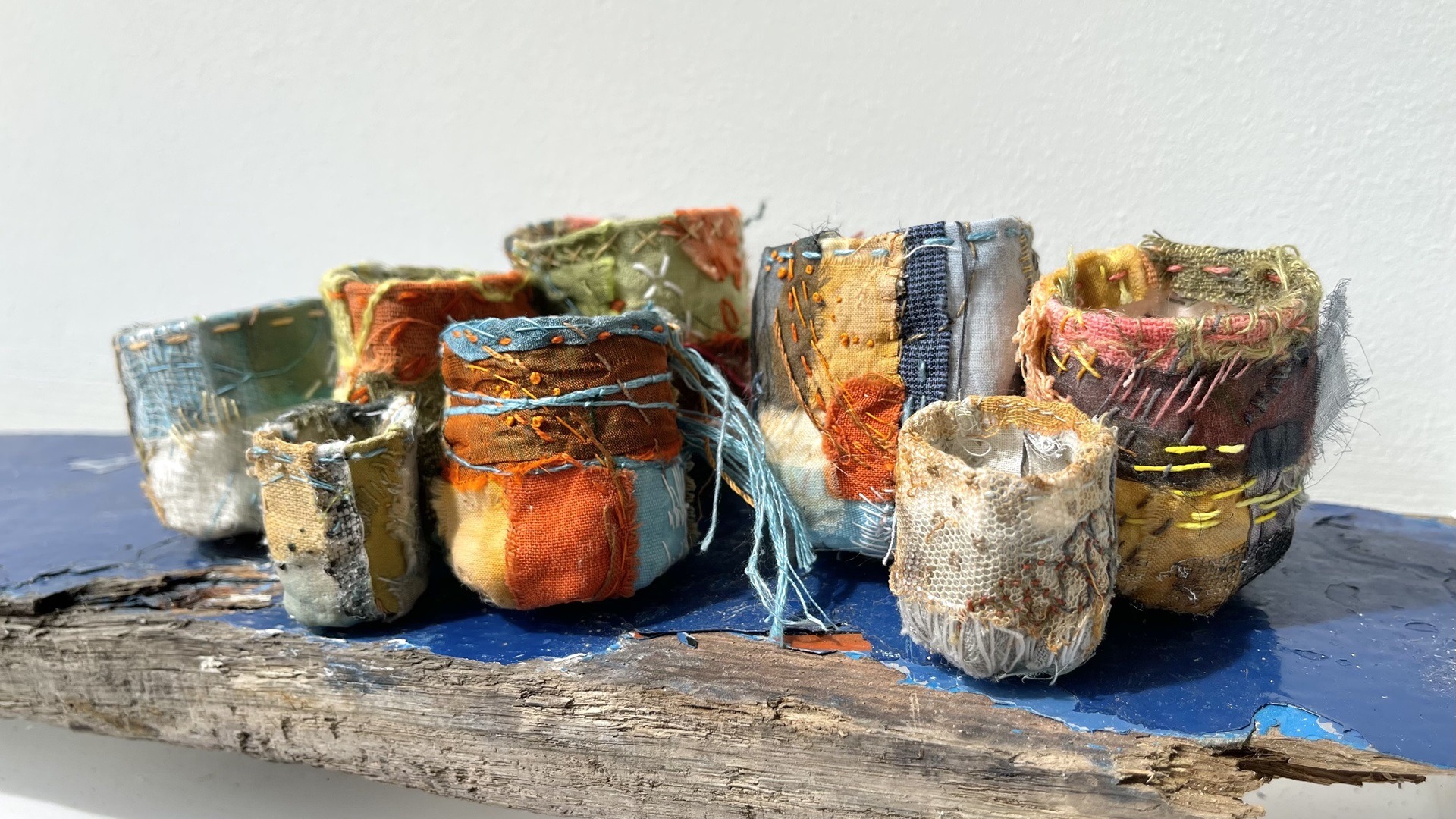 Rachael Singleton, Irish Stitchpots, 2022. 5cm to 8cm high (2" to 3" high). Hand stitch. Calico, natural fabrics.