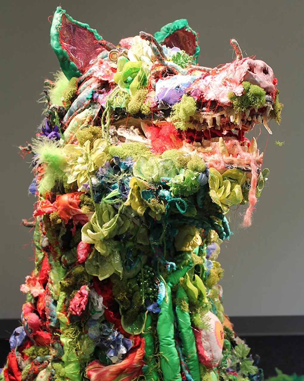 Kelly Boehmer, Puppy, 2017. 122cm x 91.5cm x 91.5cm (48" x 36" x 36"). Hand stitch. Fibres, taxidermy, synthetic flowers, glitter, metal.