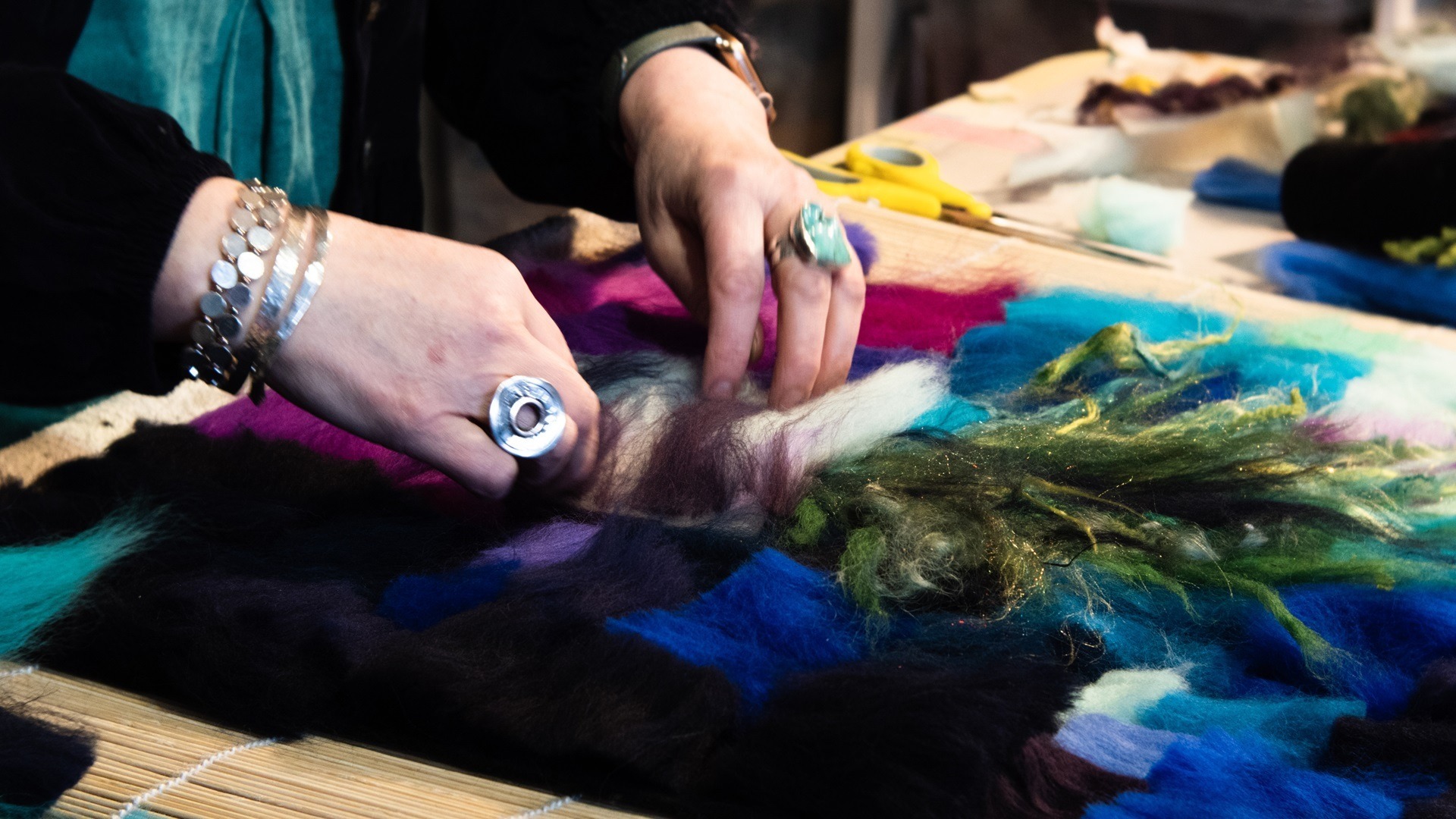 Moy Mackay working on a new composition using pre-coloured merino tops.