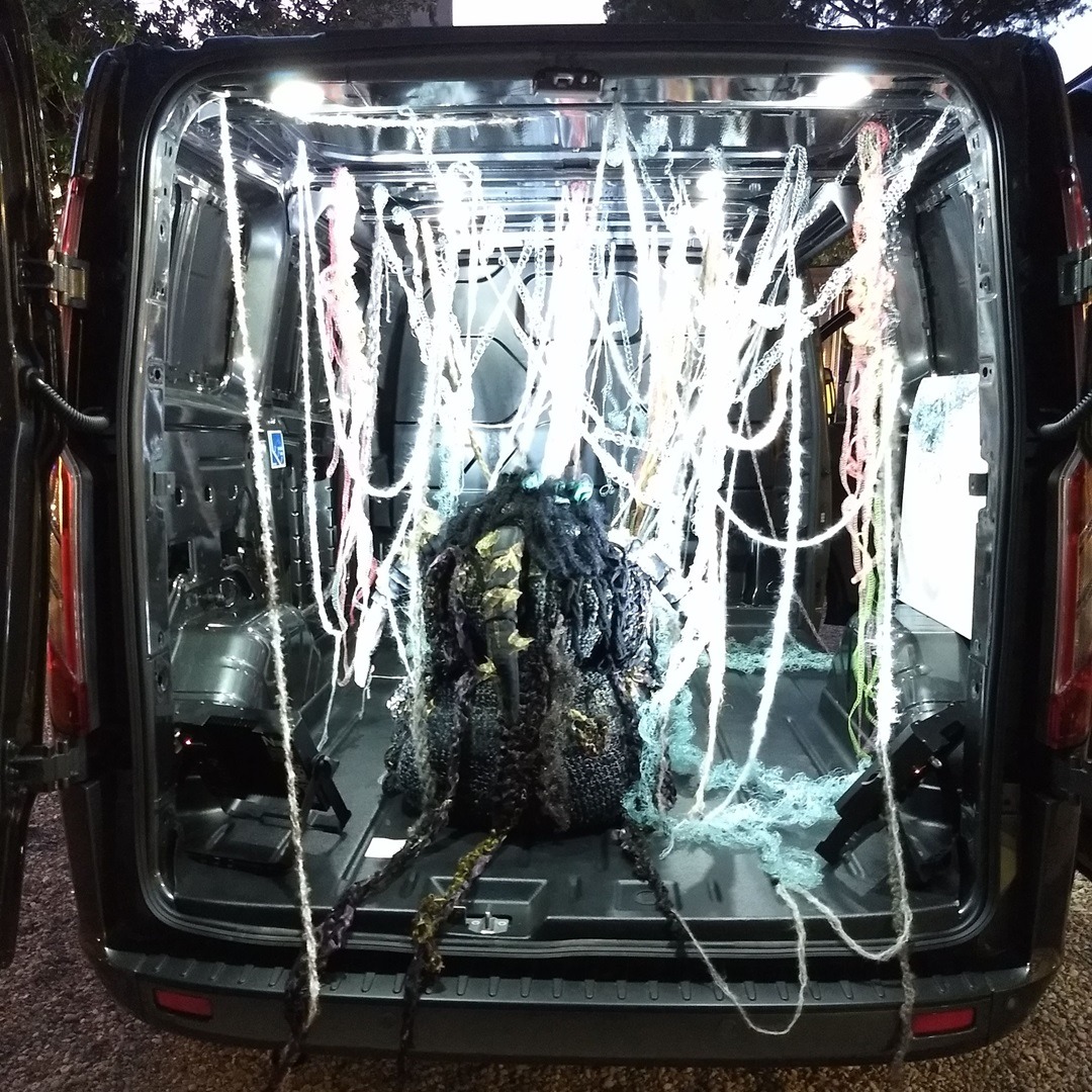 Olga Teksheva, Appearing/Disappearing, 2019. Installation. Crochet, hand embroidery. Ford van, fishing thread, cotton, vintage satin, wool, acrylic fibres, metallized lace, recycled clothing.