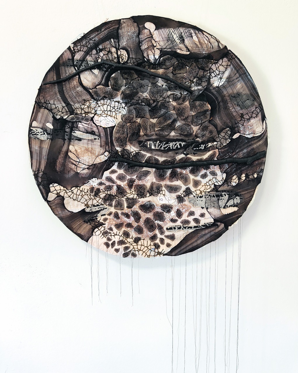 Olga Teksheva, Black (The Sphere Series), 2023. 65cm x 65cm x 5cm (26" x 26" x 2"). Hand embroidery, textile collage. Felt base, wood structure, felt jute, chiffon, nylon, vintage Marimekko cottons, recycled tights, tree branches.