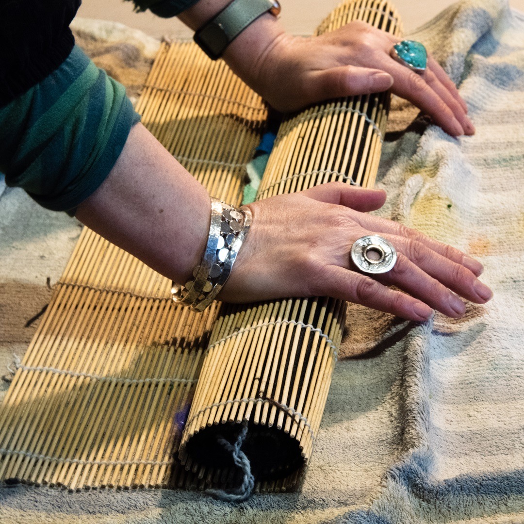 Moy Mackay working on a new composition using pre-coloured merino tops.