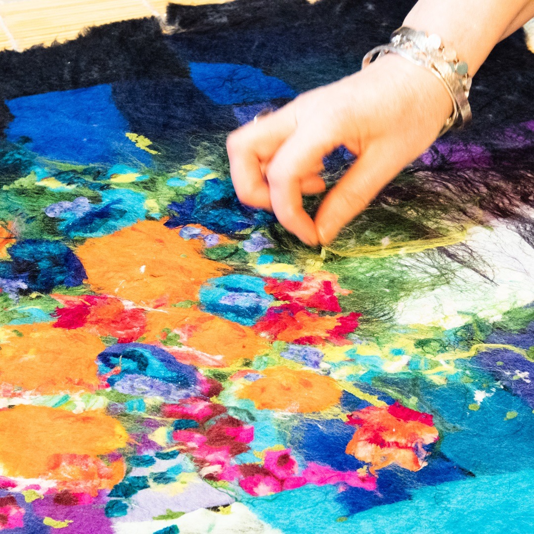 Moy likes to tweak her composition after the first felting stage.