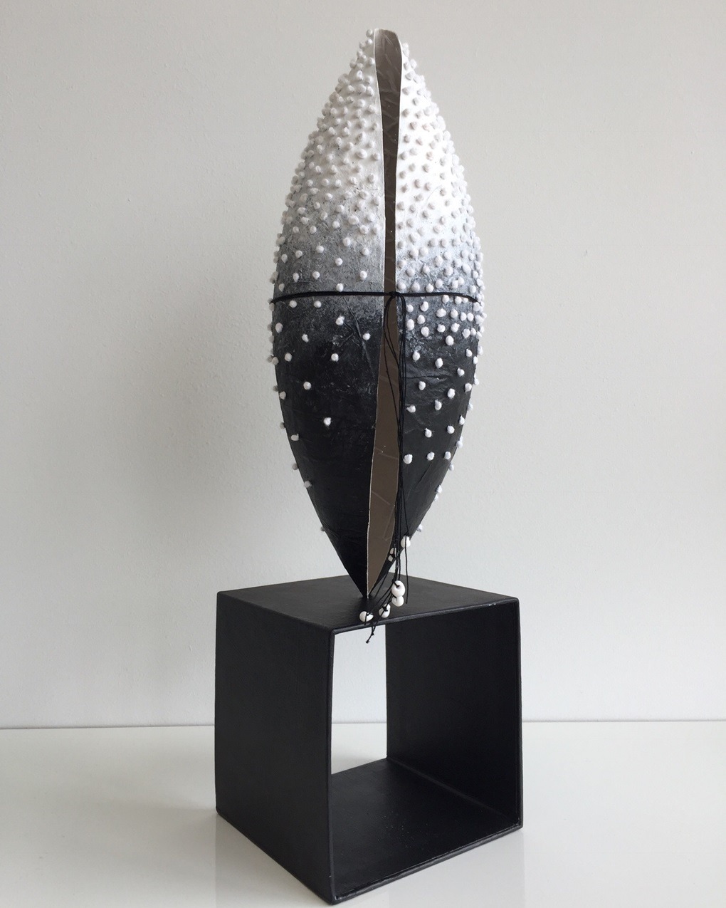 Rachael Singleton, Upright Pod, 2018. 25cm to 35cm (10" to 14"). Papier mache, hand stitch. Teabag paper, CMC paste, acrylic paint, embroidery thread.