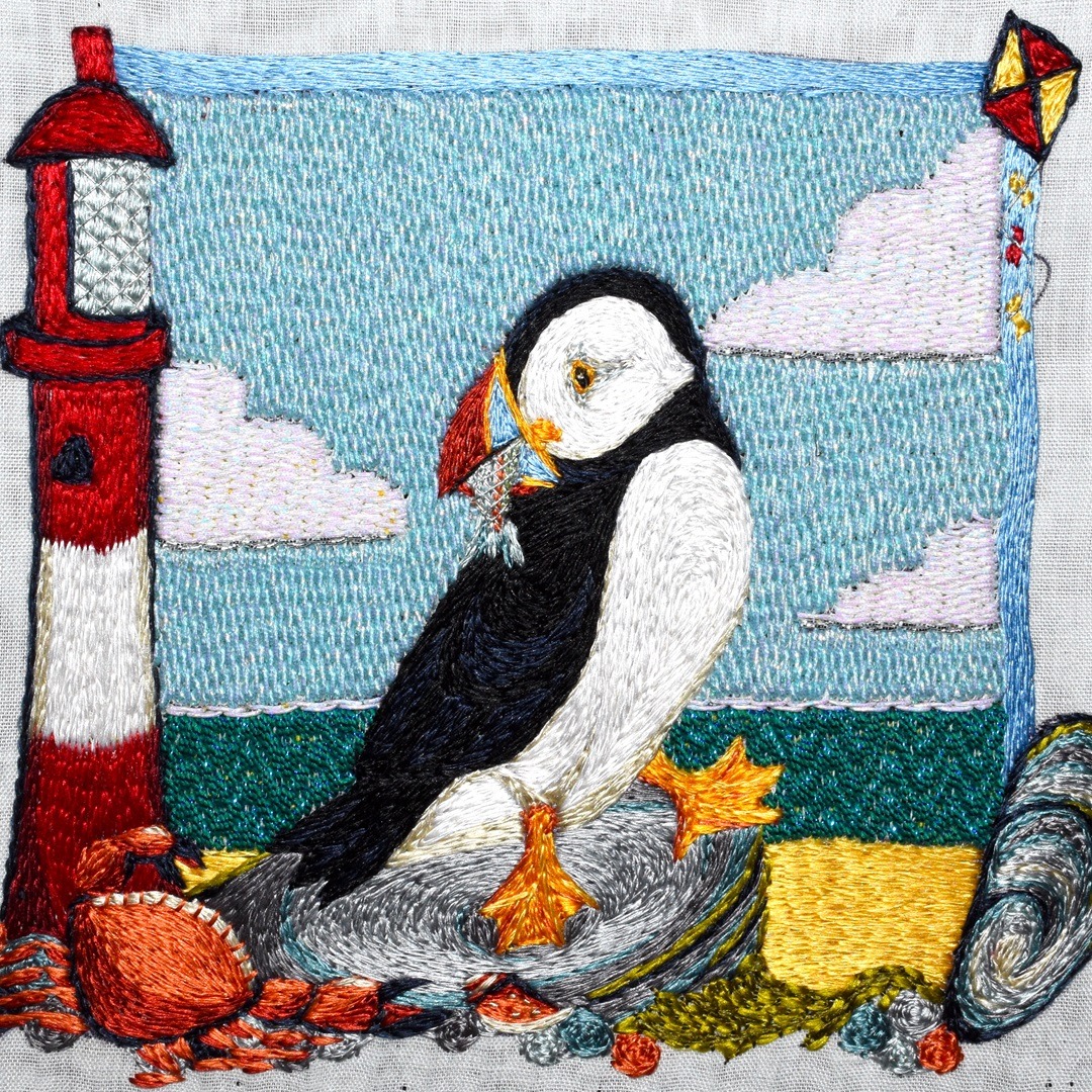 Tanya Bentham, Puffin, 2023. 12cm x 12cm (4½" x 4½"). Hand stitch. Silk, metal.