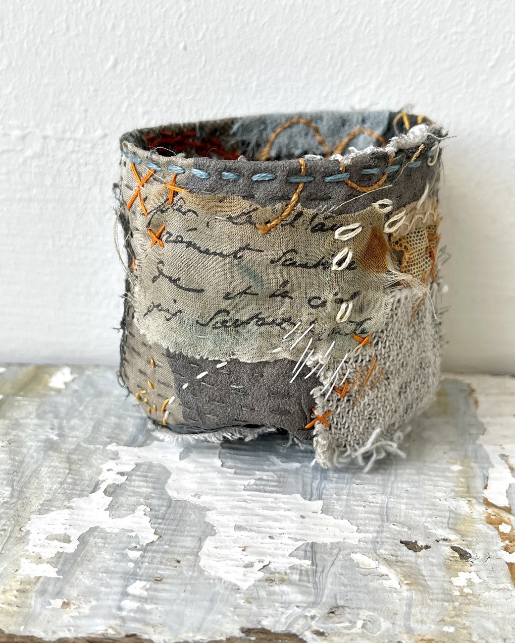Rachael Singleton, Worn and Weathered Stitchpots, 2022. 5cm to 8cm high (2" to 4" high). Hand stitch. Calico, natural and vintage fabrics.