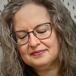 Close up of Jo Morphett working on her textiles work.