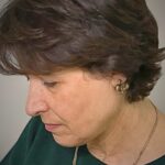 Close up of Batool Showghi working on her textiles work.