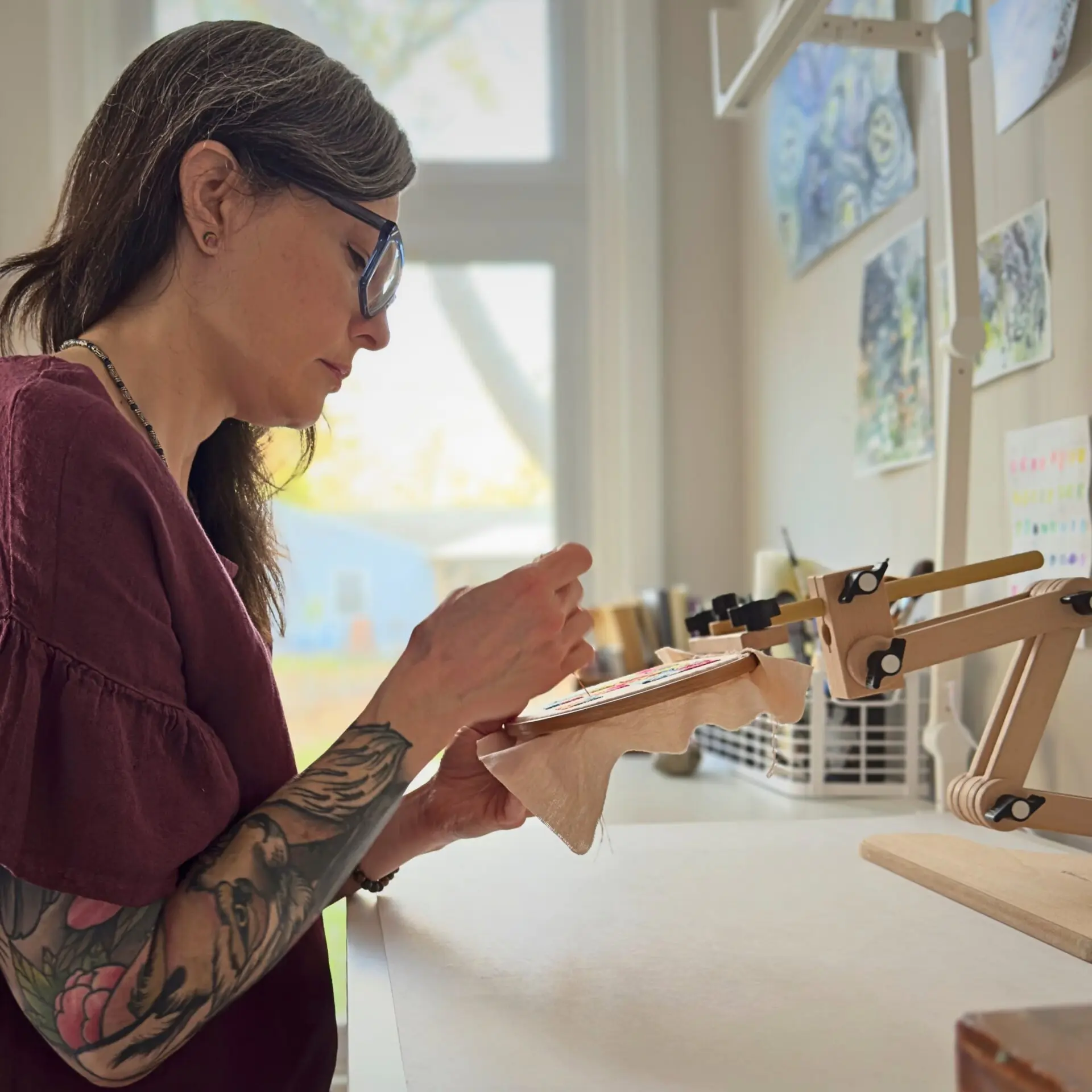 Heather Kerley working in her studio at a workspace.