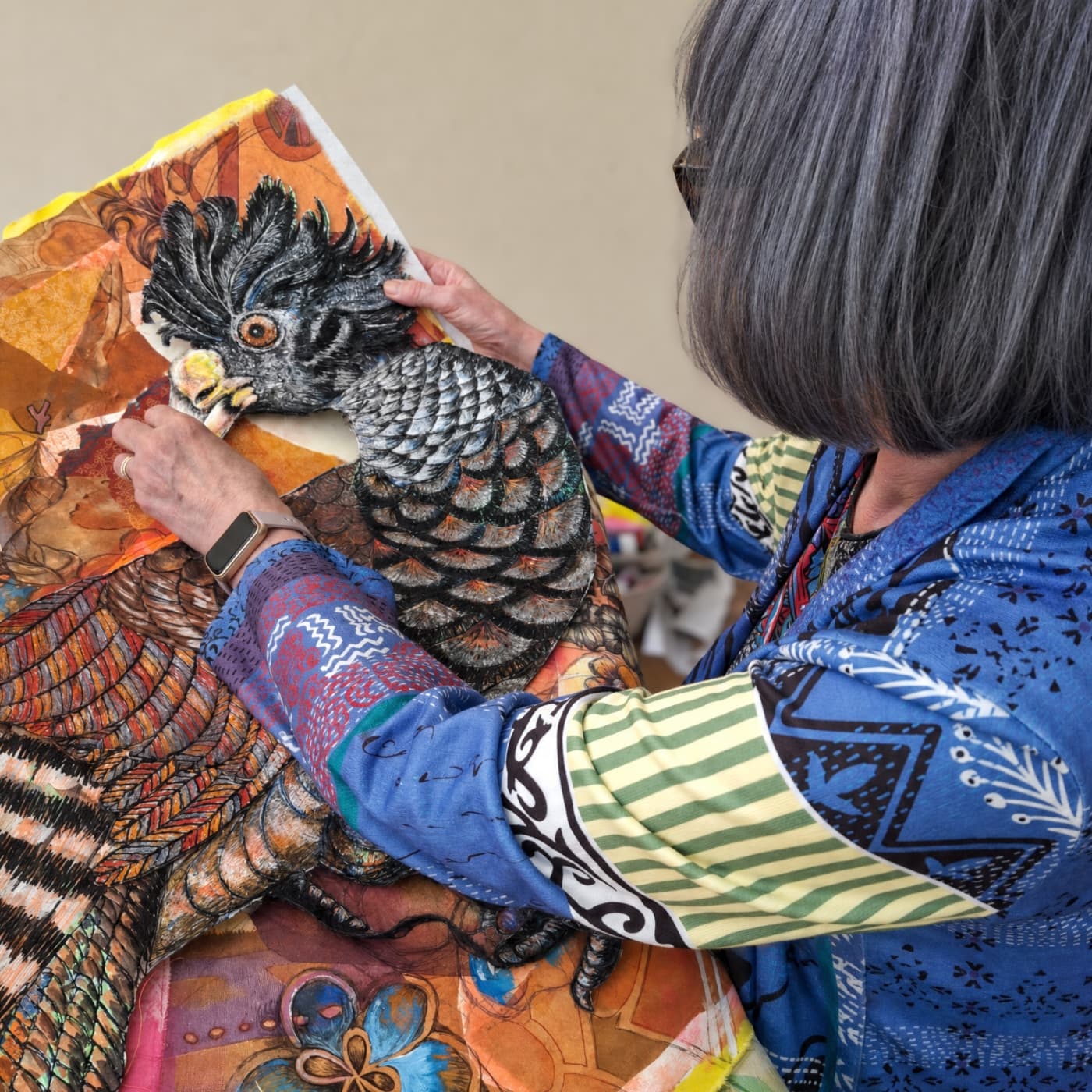 Textile artist Nikki Parmenter creating detailed textile artwork.