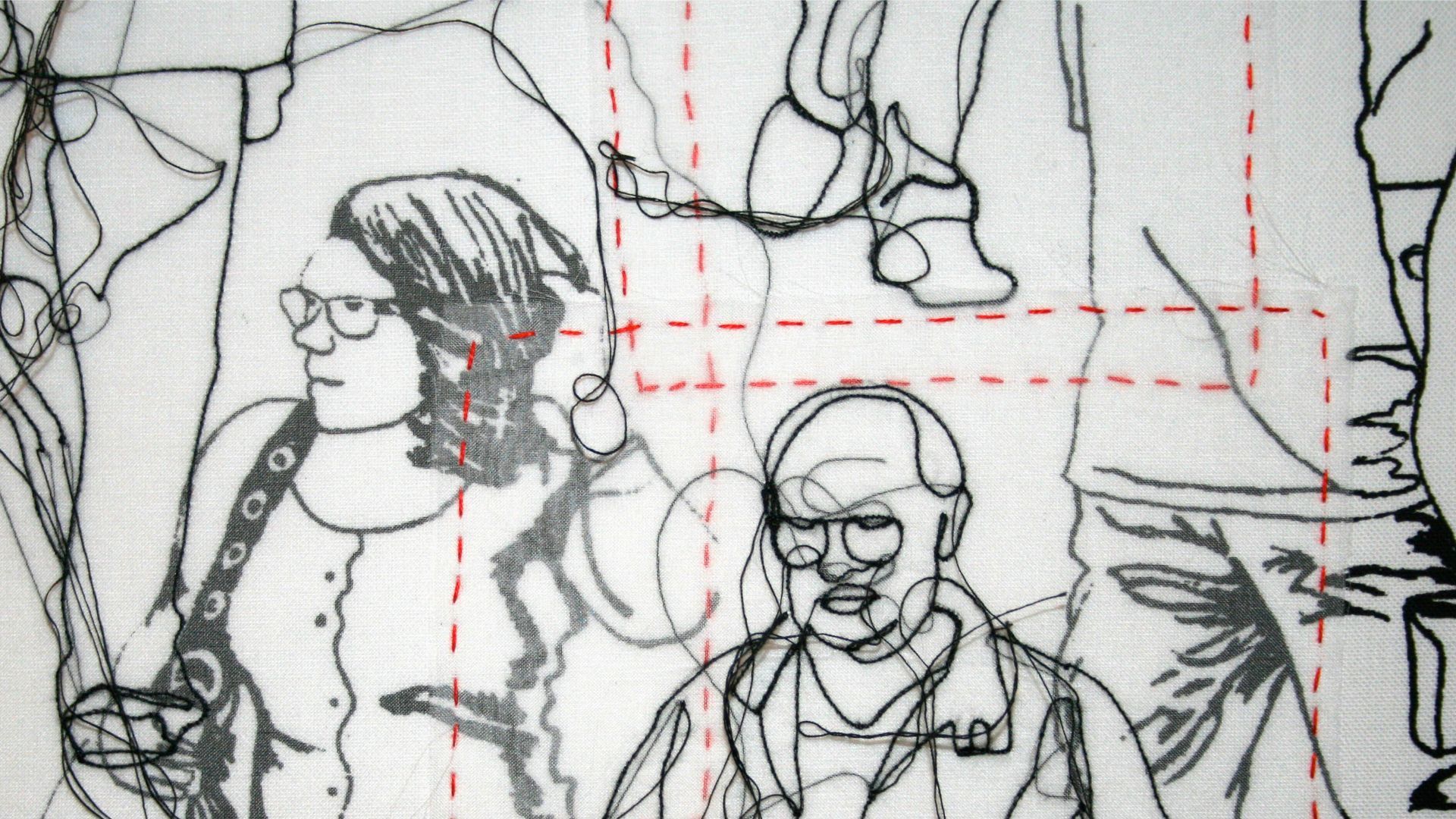 Close-up detail of a fabric artwork with everyday people stitched in black, white and red