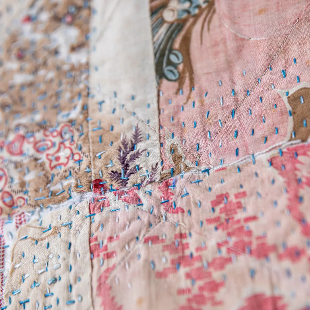 Hannah Lamb, At Home (detail), 2021. 47cm x 70cm x 2.5cm (18½" x 27" x 1"). Hand stitch, quilting and construction techniques. Vintage cotton and linen fabrics, thread and wood. Photo: Proud Fox