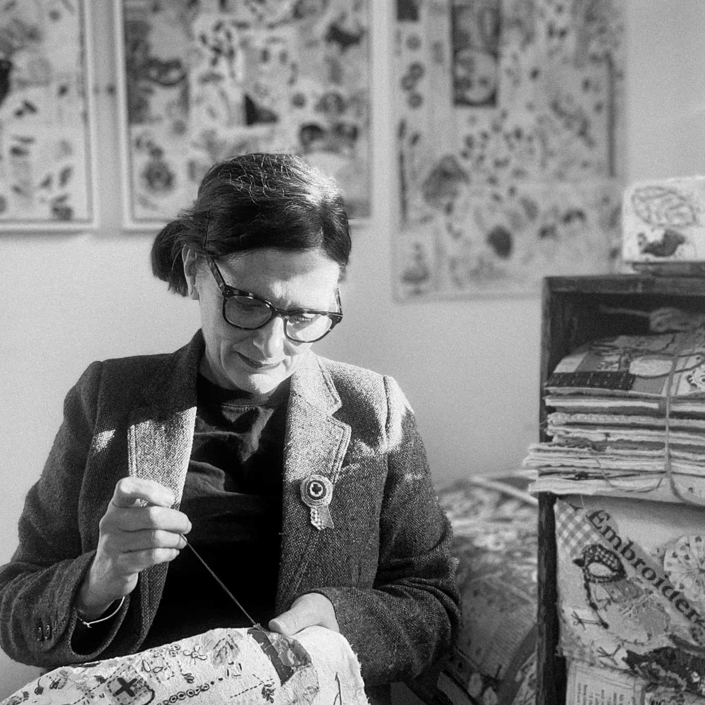 Suzette Smart working on her embroidery in her workshop.