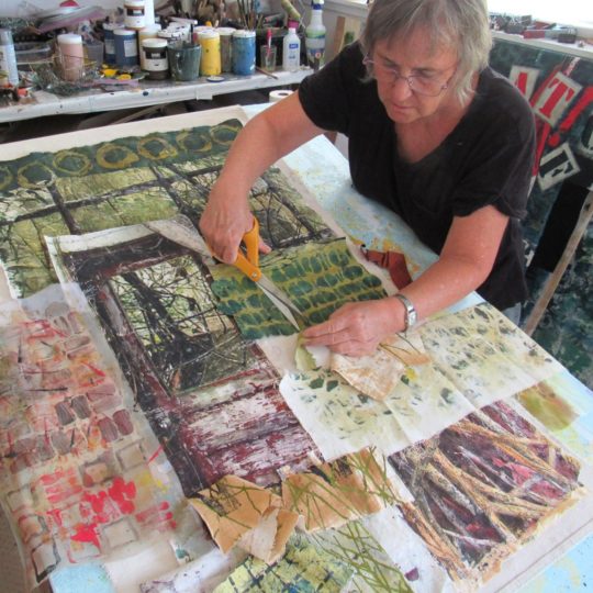 Bobbi Baugh assembling artwork in her studio.
