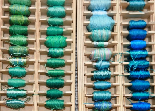 A collection of threads organised by colour