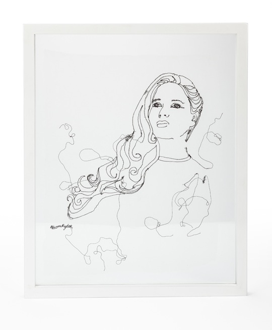 An embroidered piece on silk chiffon in a glass frame made on commission for singer/songwriter Mary Epworth by textile artist Naomi Ryder