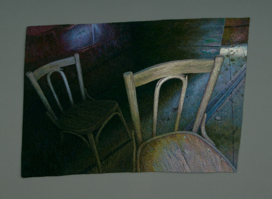 A piece depicting two chairs by photo-realistic textile artist Carol Shinn