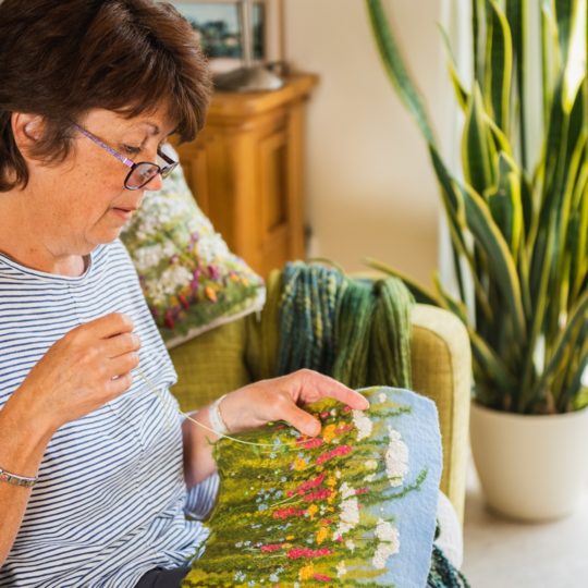 Lynn Comley at work in her studio