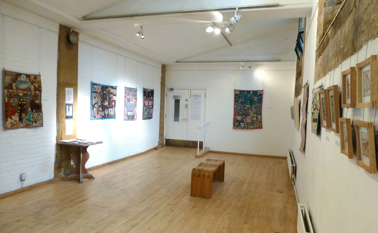 View of gallery where textile artist Anne Kelly's recent exhibition Small Worlds took place