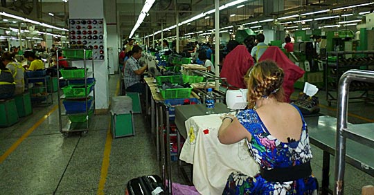 Harriet Riddell stitching at a factory in India