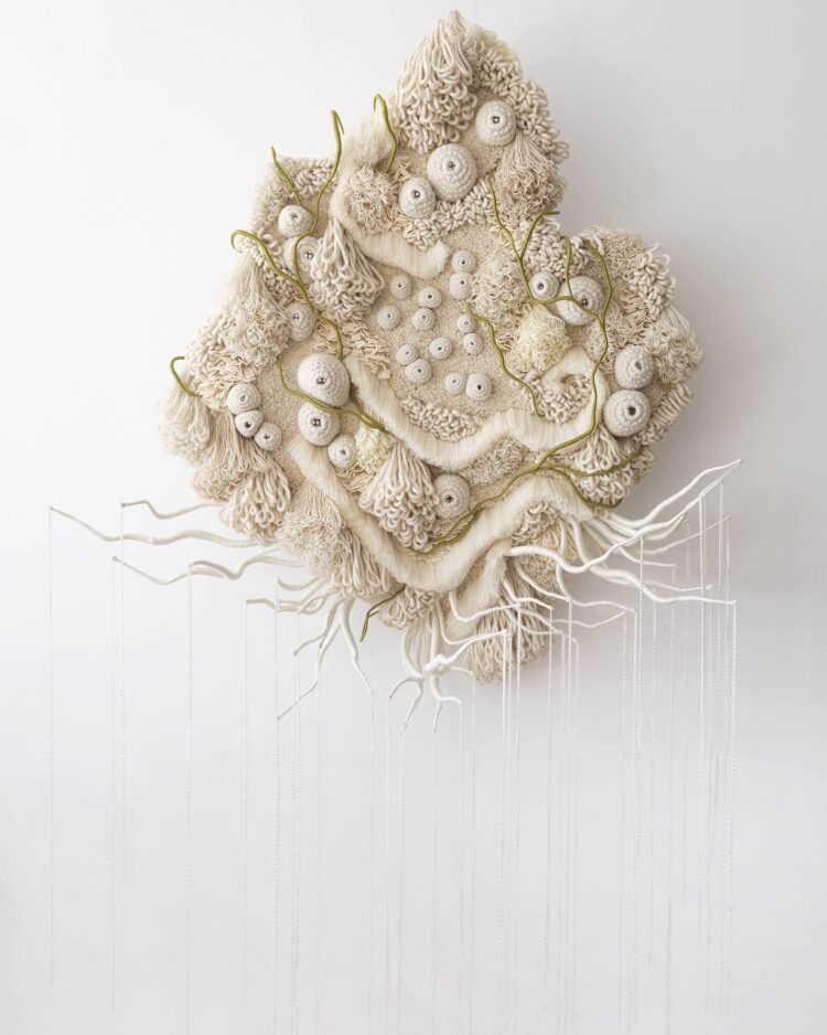 Vanessa Barragao, Afterlife I, 2023. 140cm x 30cm x 230 cm (55" x 12" x 91"). Latch hook, crochet, fibre manipulation. Wool, tencel, jute backing, brass signature badge, repurposed fibres from textile factories.