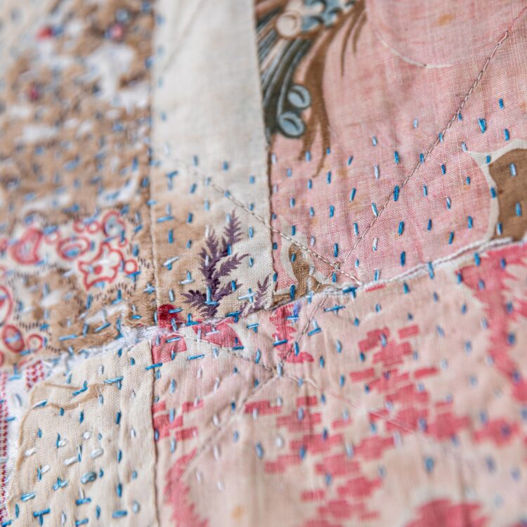 Hannah Lamb, At Home (detail), 2021. 47cm x 70cm x 2.5cm (18½" x 27" x 1"). Hand stitch, quilting and construction techniques. Vintage cotton and linen fabrics, thread and wood. Photo: Proud Fox