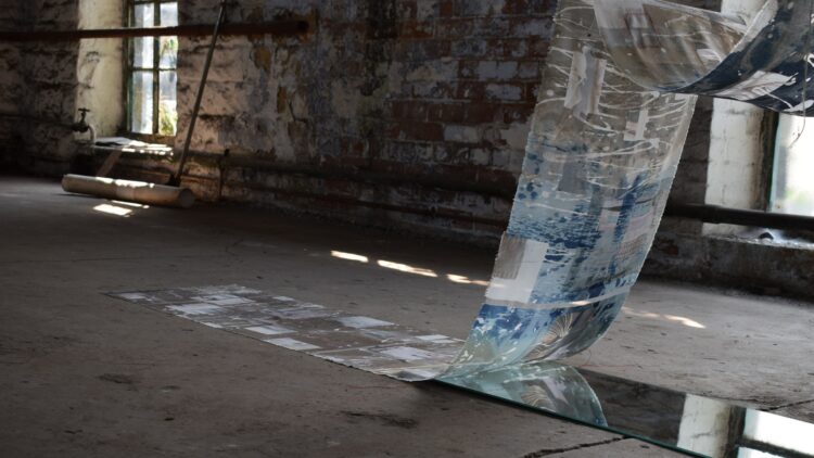 Hannah Lamb, [De]Constructed Cloth, 2019. 300cm x 160cm x 50cm (10ft x 5¼ft x 20"). Cyanotype, devoré, digital print, stitch and appliqué. Mixed fibre fabric, threads, mirror, vintage bobbin.