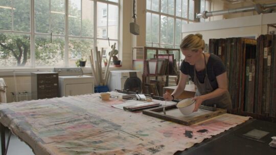Hannah Lamb printing in her studio.