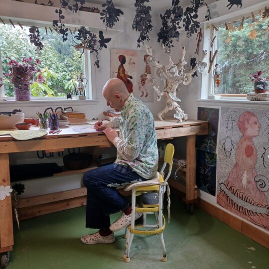 Self-taught textile artist Danny Mansmith working in his studio.