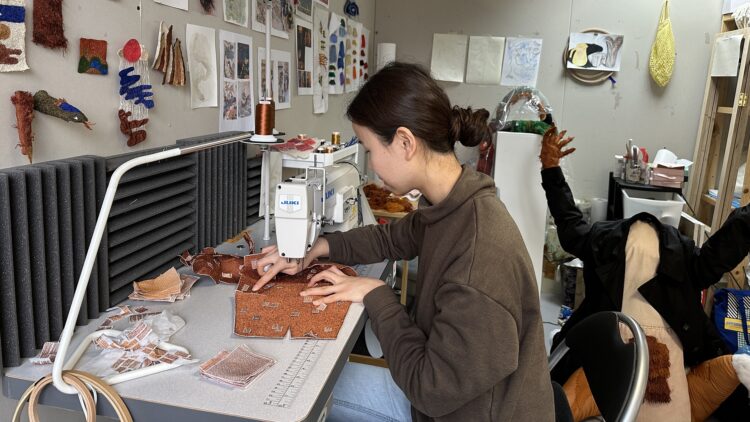 Woo Jin Joo working in her studio in South East London, 2023