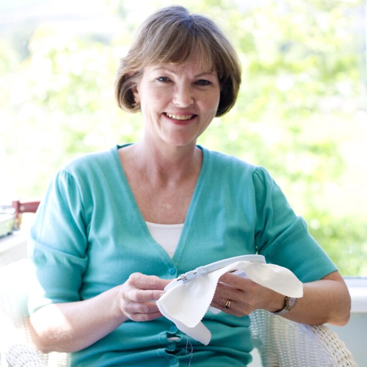 Trish Burr stitching in her studio.