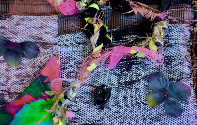 Zipporah Camille Thompson, chrysalis, (detail), 2021. 81cm x 38cm x 8cm (32" x 15” x 3"). Hand stitch, weaving. Handwoven hand-dyed fibre, digital photography printed on fabric, faux flowers, cotton, yarn, ribbon, raiffa, ceramic, cotton fringe. Photography: Mike Jensen.