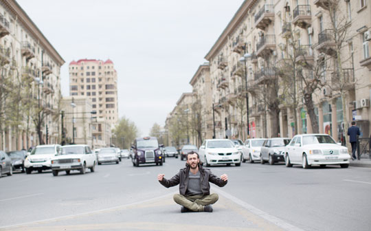 Artist Faig Ahmed sits in the street, Baku
