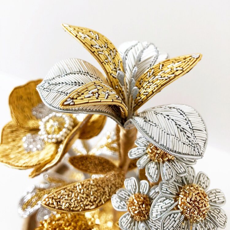 Hannah Mansfield, Summer Flowers Sculpture (detail), 2019. 40cm x 20cm (15¾” x 7¾”) including glass dome. Goldwork embroidery. Gold and silver goldwork wires, silk organza, metallic thread, metal beads, metallic leaf, silk ribbon, wire, tissue paper, clay.