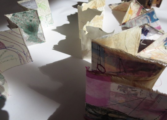 San Diego Book Arts 1: Samples the results of a short in exercise drawing, folding and stitching. The pieces create interesting shadows.