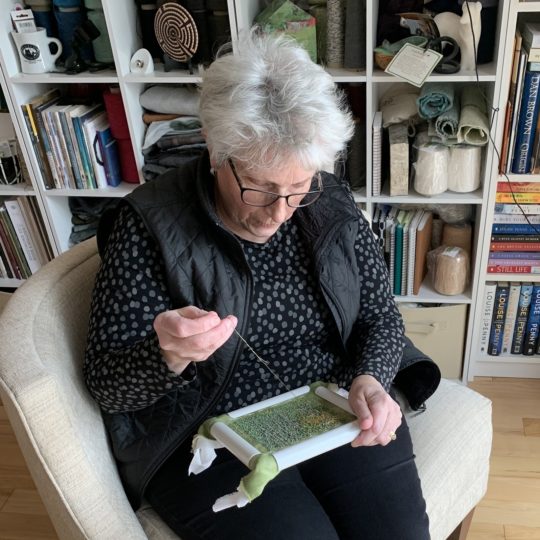 Martha Fieber working in her studio.