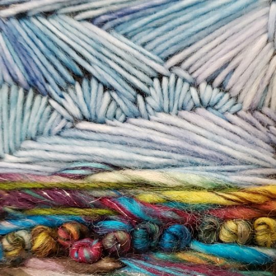 Monika Kinner, Prairie Skies (detail), 2019. 6cm x 12cm (2.5” x 5”). Freestyle hand stitching. Yarn and felt.