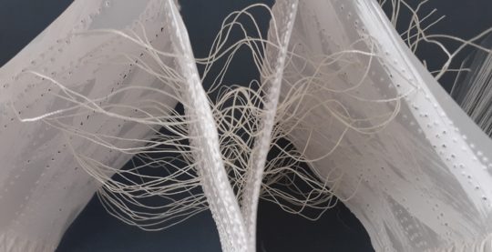 Siân Martin, Whispering (detail), 2020. 100cm x 50cm x 13cm (40" x 20" x 5"). Vellum, acrylic, threads, chiffon strips. Needle perforations/machine stitch, threading, lacing, tying