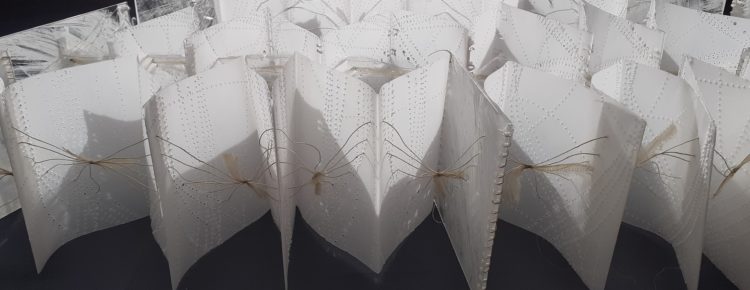 Sian Martin, Whispering, 2020. 100cm x 50cm x 13cm (40" x 20" x 5"). Vellum, acrylic, threads, chiffon strips. Needle perforations/machine stitch, threading, lacing, tying.