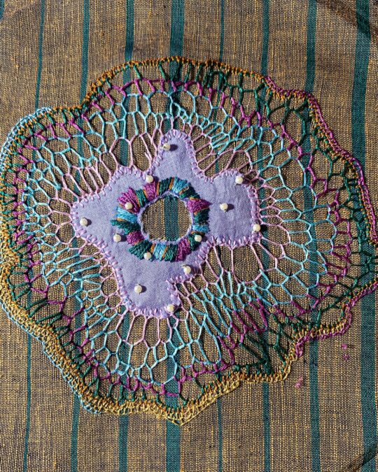Gopika Nath, Organic blanket stitch organism, 2023. 13cm x 13cm (5" x 5"). Appliqué, buttonhole stitch. Anchor cotton threads, cotton-silk mix fabric, beads.