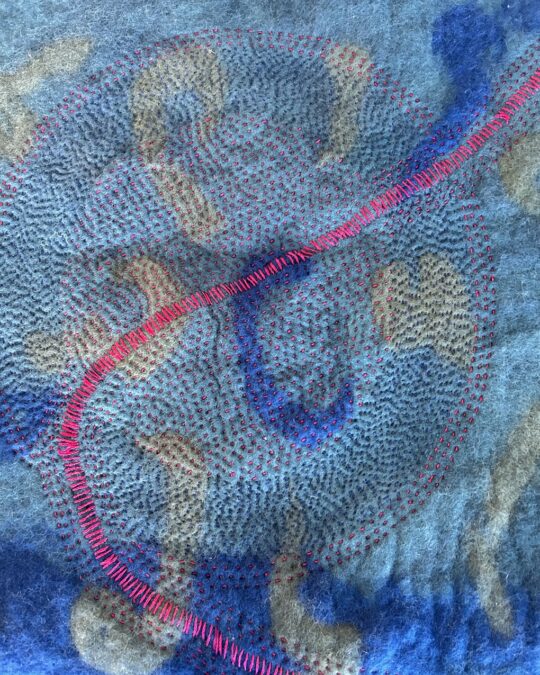 Suzanne Russell, Road Less Travelled, 2023. 19cm x 35cm (8" x 14"). Wet felting, hand stitch. Merino wool fibres, silk fibres, rayon threads.