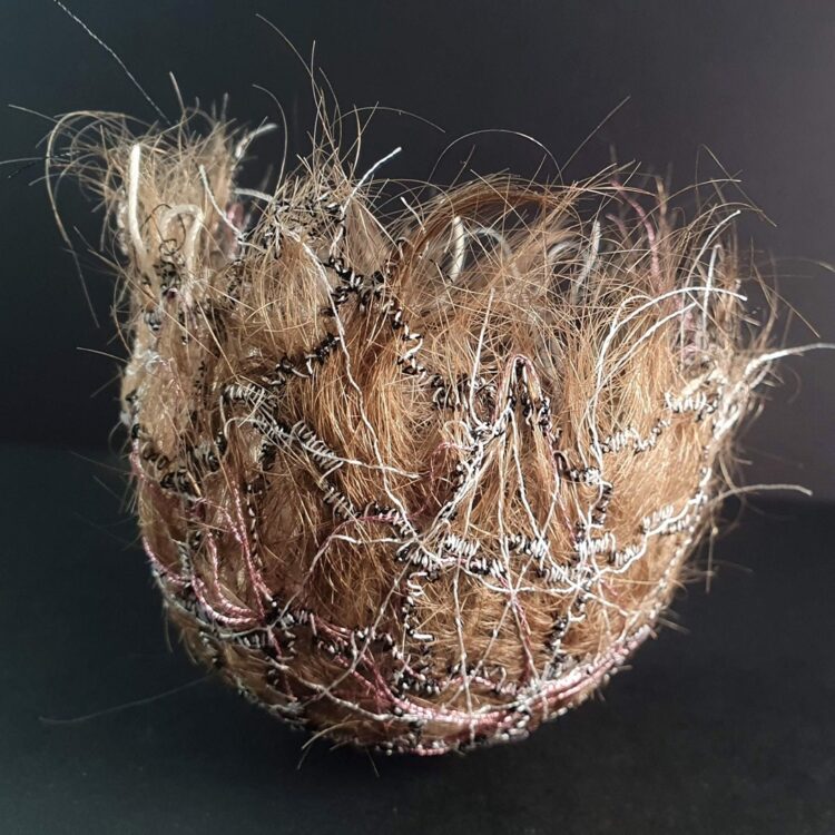 Zane Shumeiko, Hair Bowl (2023). 8cm x 8cm x 7cm (3" x 3" x 3"). Free motion machine stitch, sculpting with water-soluble film, hand embroidery. Hair, threads. 